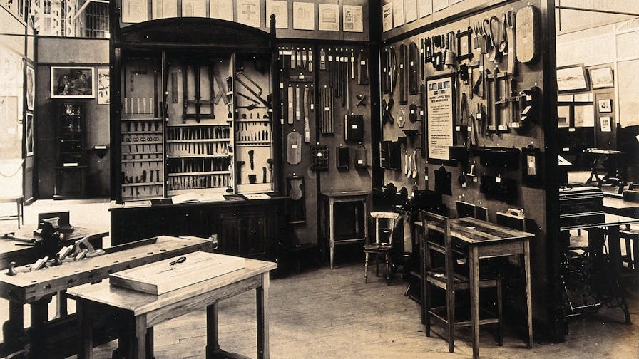 The 1904 World's Fair, St. Louis, Missouri: a Swedish exhibit showing a 'sloyd' (wood craftwork) workroom and tools. Photograph, 1904