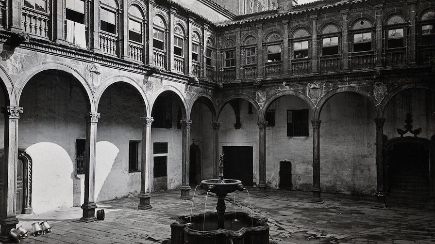 Hospital Real, Santiago de Compostela: view of the courtyard showing the fountain. Photograph, ca.1900